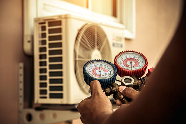 Professional Air Conditioning Service technician working in Elon, NC